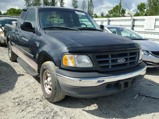 1FTZX1768WNC19402 - 1998 FORD F150 BLACK photo 1