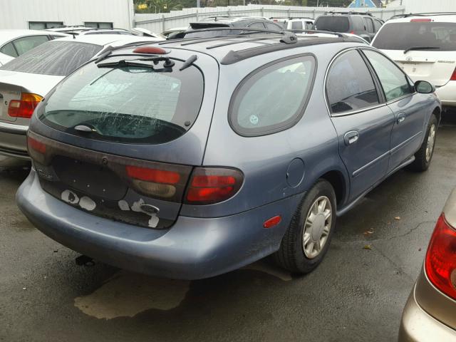 1FAFP58S9XG143559 - 1999 FORD TAURUS SE BLUE photo 4