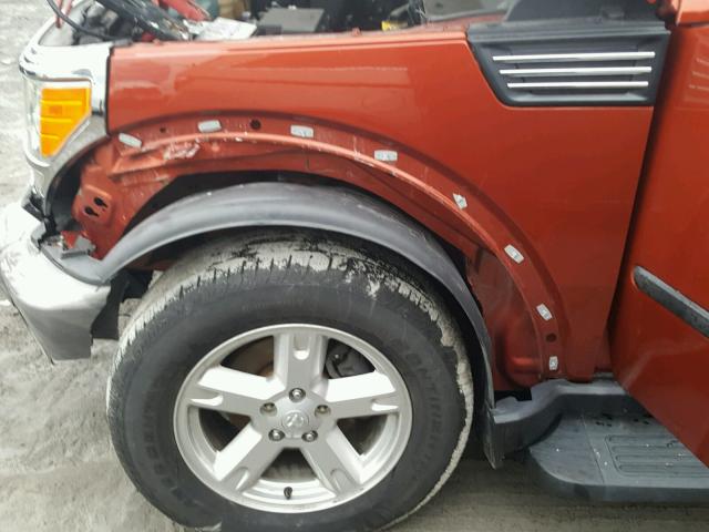 1D8GU28KX7W654761 - 2007 DODGE NITRO SXT ORANGE photo 9