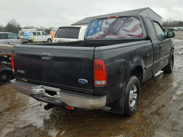 1FTZX1725WNB85139 - 1998 FORD F150 BLACK photo 4