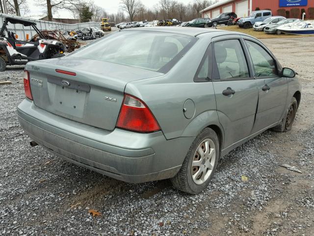 1FAFP34N65W281812 - 2005 FORD FOCUS ZX4 GREEN photo 4