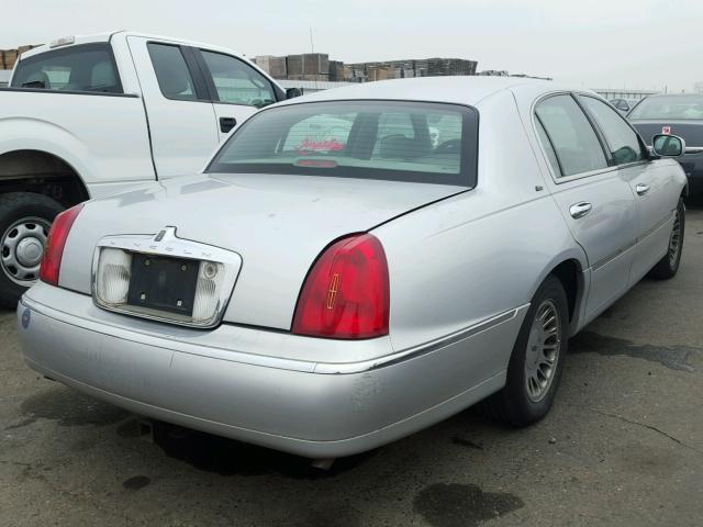 1LNHM83W4XY614952 - 1999 LINCOLN TOWN CAR C SILVER photo 4