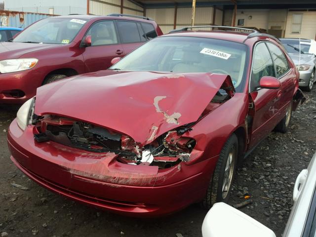 1FAFP58S6YG190954 - 2000 FORD TAURUS SE RED photo 2