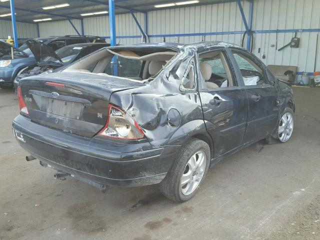 1FAFP34P52W231402 - 2002 FORD FOCUS SE BLACK photo 4