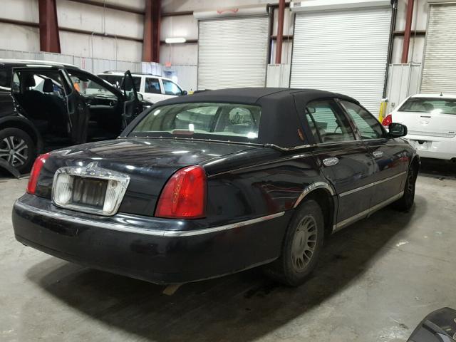 1LNHM83W8XY692585 - 1999 LINCOLN TOWN CAR C BLACK photo 4