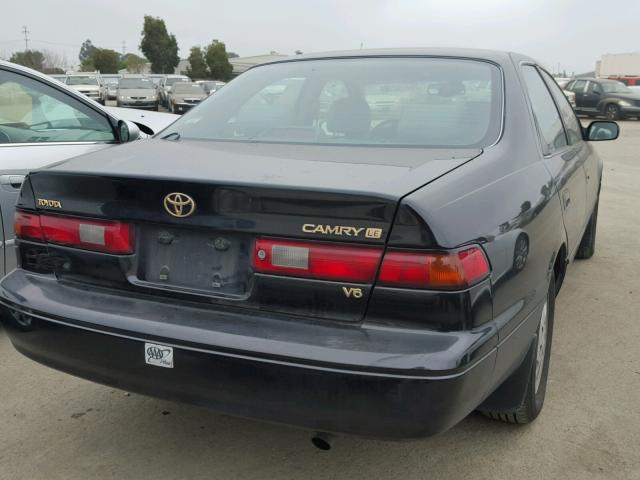 JT2BF28K8X0170604 - 1999 TOYOTA CAMRY LE BLACK photo 4