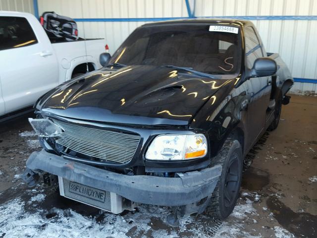 2FTZF0738XCA96551 - 1999 FORD F150 SVT L BLACK photo 2