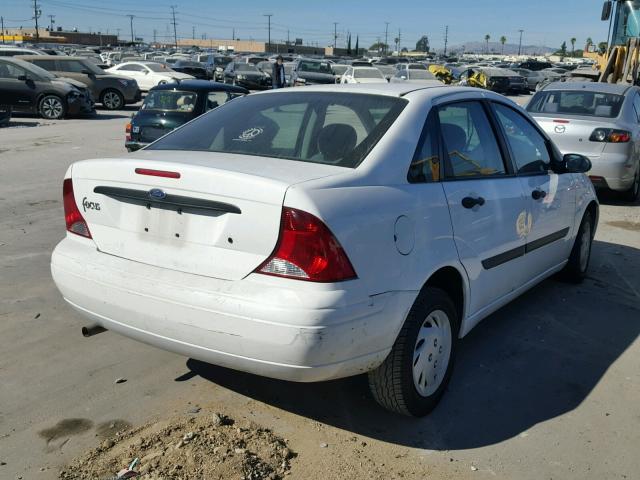 1FAFP33Z34W142904 - 2004 FORD FOCUS LX WHITE photo 4