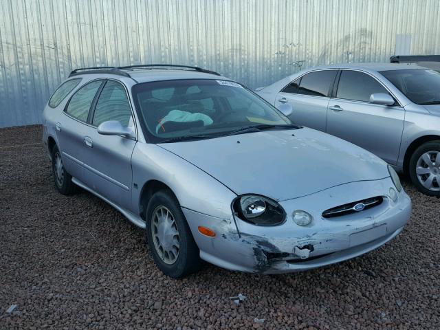 1FAFP58S2XG223785 - 1999 FORD TAURUS SE SILVER photo 1