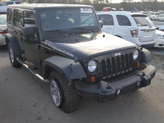 1J4HA6H10BL501577 - 2011 JEEP WRANGLER U BLACK photo 1