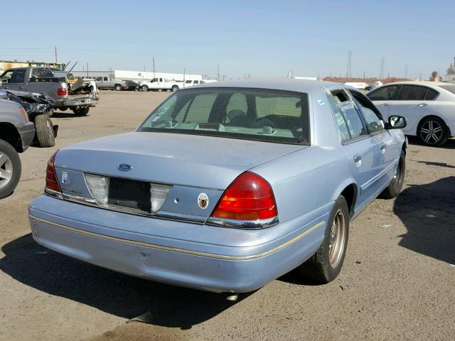 2FAFP74W9YX130004 - 2000 FORD CROWN VICT BLUE photo 4