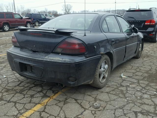 1G2NV52E61C129605 - 2001 PONTIAC GRAND AM G BLACK photo 4