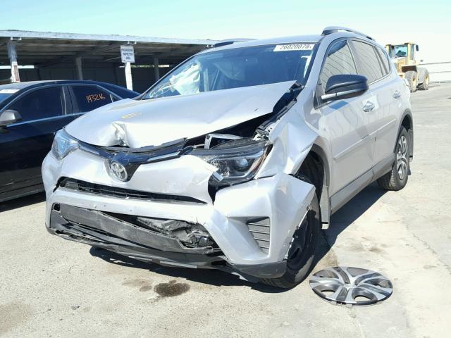 2T3ZFREV8GW275507 - 2016 TOYOTA RAV4 LE SILVER photo 2