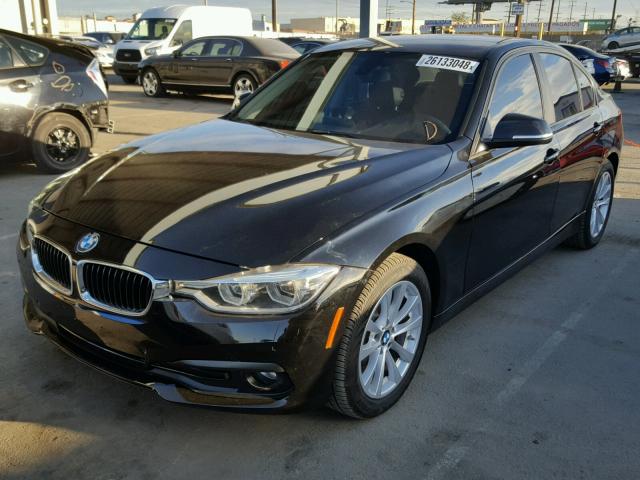 WBA8E1G52HNU12931 - 2017 BMW 320 I BLACK photo 2