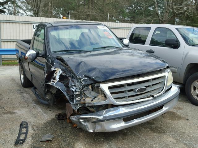 1FTRF17212NB70957 - 2002 FORD F150 BLACK photo 1