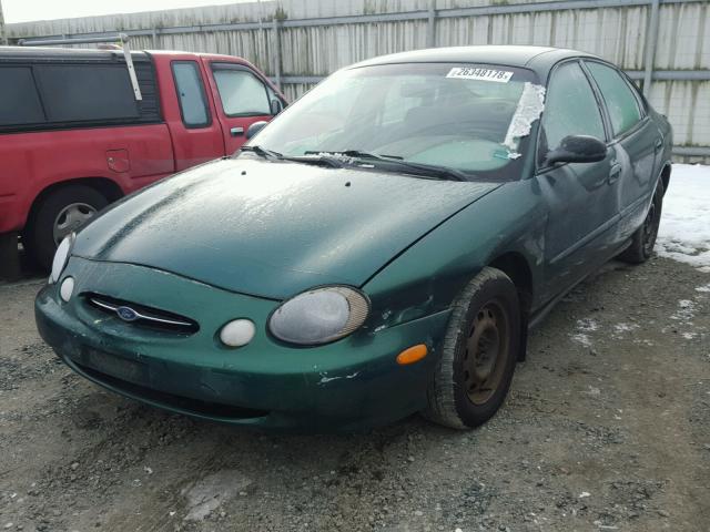 1FAFP53S2XG132409 - 1999 FORD TAURUS SE GREEN photo 2