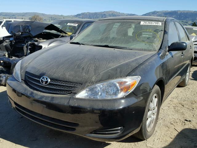 JTDBF30K520035761 - 2002 TOYOTA CAMRY LE BLACK photo 2