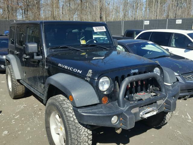 1J4HA6H18BL501469 - 2011 JEEP WRANGLER U BLACK photo 1