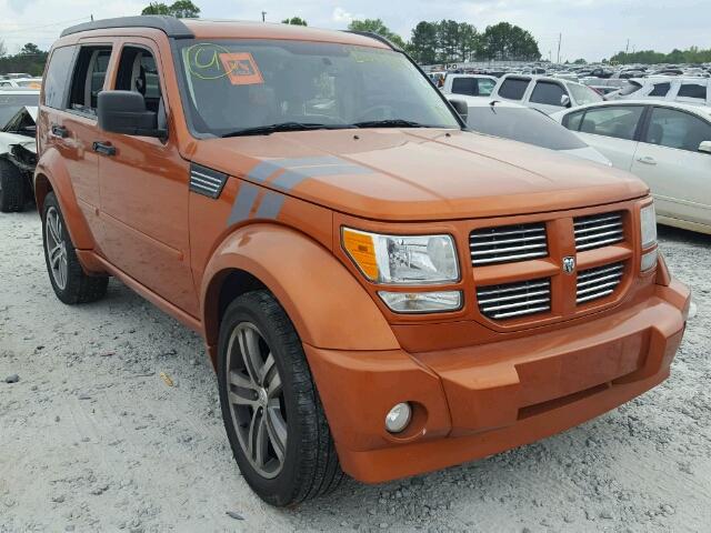 1D4PT7GX7BW590024 - 2011 DODGE NITRO SHOC ORANGE photo 1