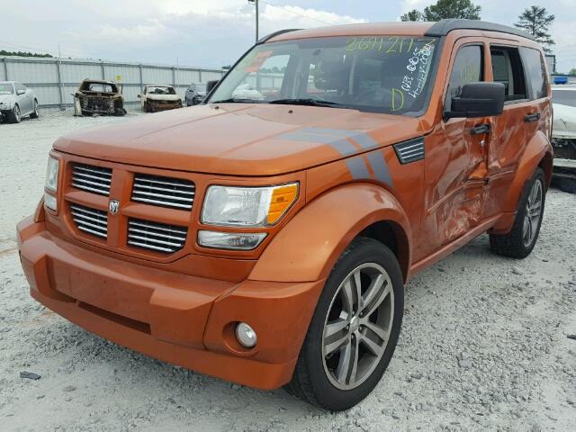 1D4PT7GX7BW590024 - 2011 DODGE NITRO SHOC ORANGE photo 2