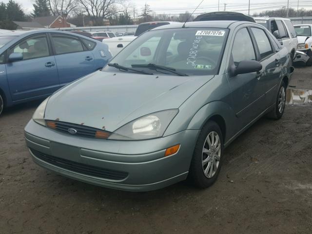 1FAFP343X4W170726 - 2004 FORD FOCUS SE C GREEN photo 2