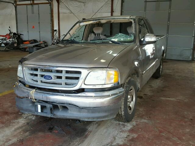 2FTRX17W72CA85577 - 2002 FORD F150 GOLD photo 2