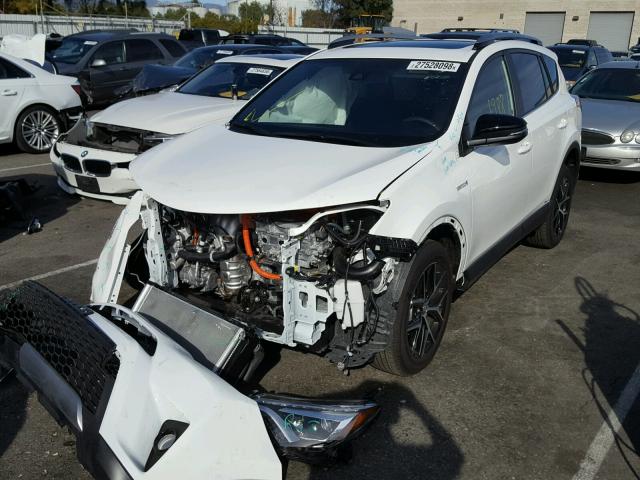 JTMJJREVXJD167101 - 2018 TOYOTA RAV4 HV SE WHITE photo 2