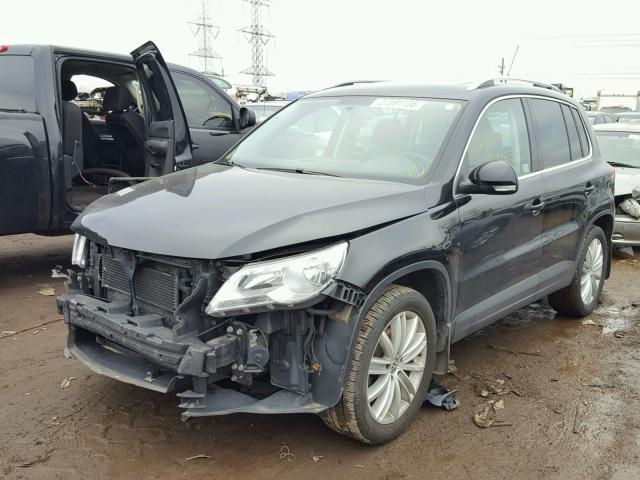 WVGAV7AX8BW500770 - 2011 VOLKSWAGEN TIGUAN S BLACK photo 2