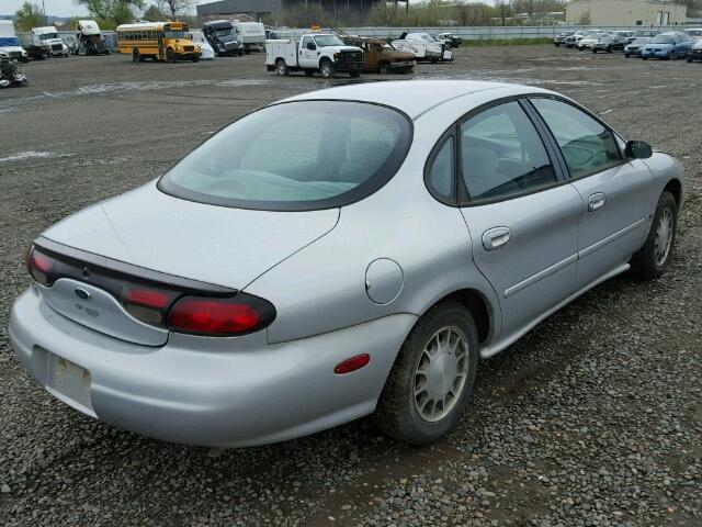 1FAFP53S4XG130788 - 1999 FORD TAURUS SE SILVER photo 4