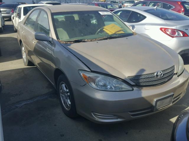 JTDBE32K120067980 - 2002 TOYOTA CAMRY LE GOLD photo 1