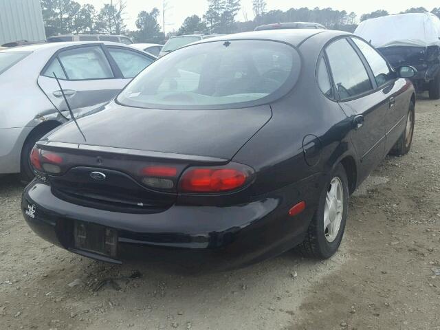 1FAFP53U1XA323789 - 1999 FORD TAURUS SE BLACK photo 4