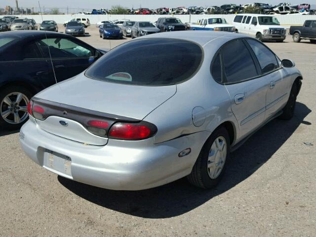 1FAFP53U3XG223139 - 1999 FORD TAURUS SE SILVER photo 4