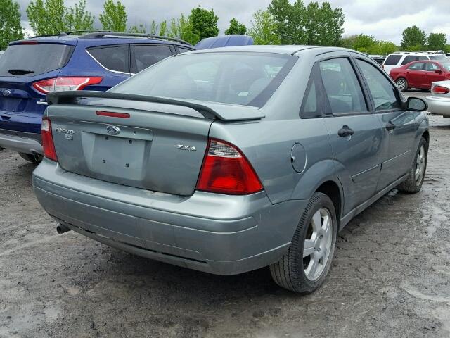 1FAFP34NX6W140310 - 2006 FORD FOCUS ZX4 GRAY photo 4