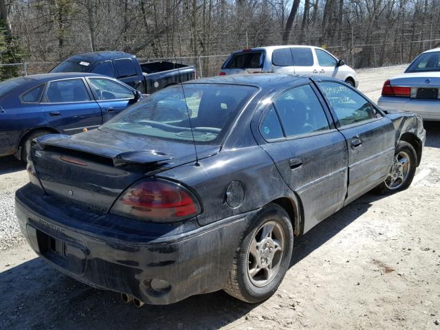 1G2NW52EX2M698546 - 2002 PONTIAC GRAND AM G BLACK photo 4