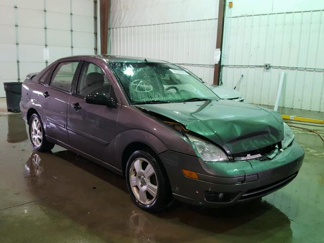 1FAFP34N25W271360 - 2005 FORD FOCUS ZX4 GRAY photo 1