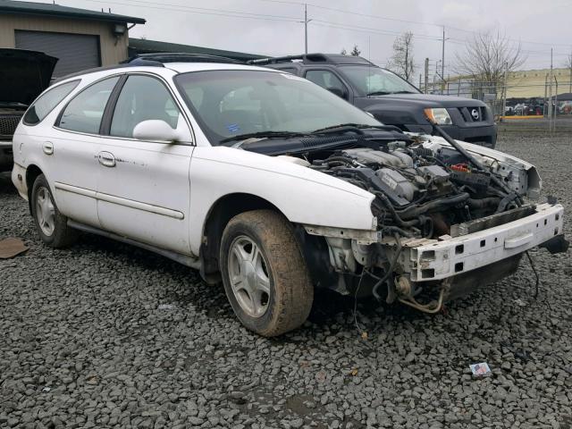 1FAFP58S4XG221648 - 1999 FORD TAURUS SE WHITE photo 1