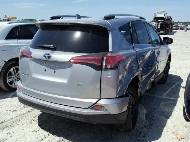 2T3ZFREV4HW395046 - 2017 TOYOTA RAV4 LE SILVER photo 4