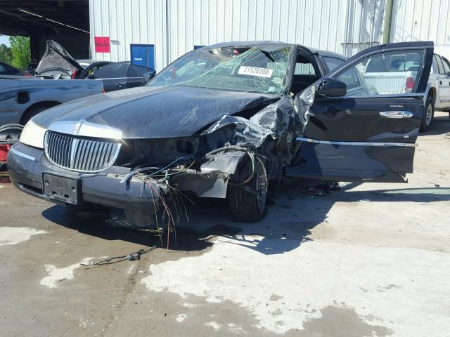 1LNHM81W5XY702461 - 1999 LINCOLN TOWN CAR E BLACK photo 2