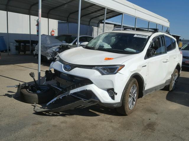 JTMRJREV6JD200579 - 2018 TOYOTA RAV4 HV LE WHITE photo 2