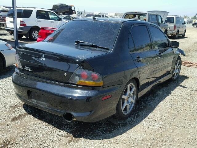 JA3AH86D65U047148 - 2005 MITSUBISHI LANCER BLACK photo 4