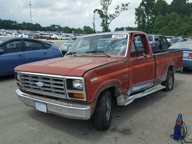 2FTDF15F1ECA09650 - 1984 FORD F150 ORANGE photo 2