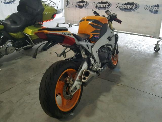 JH2SC59J59K000805 - 2009 HONDA CBR1000 RR ORANGE photo 4