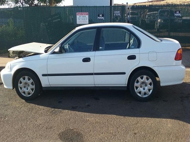 1HGEJ6675XL011323 - 1999 HONDA CIVIC LX WHITE photo 9