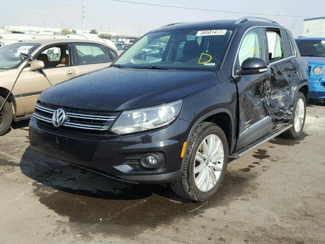 WVGBV3AX8EW587930 - 2014 VOLKSWAGEN TIGUAN S BLACK photo 2