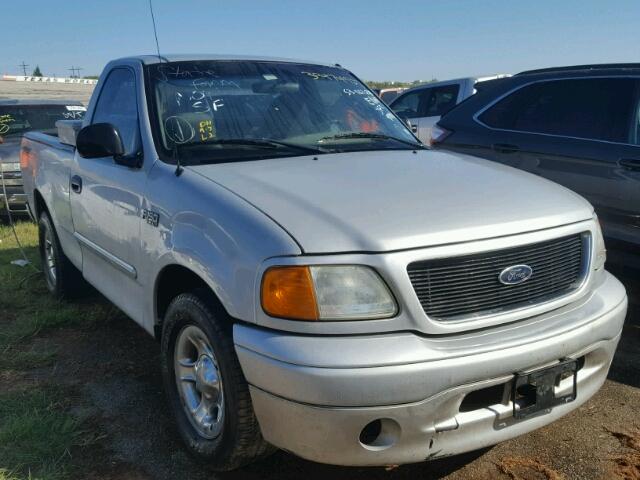 2FTRF17234CA68567 - 2004 FORD F-150 HERI SILVER photo 1