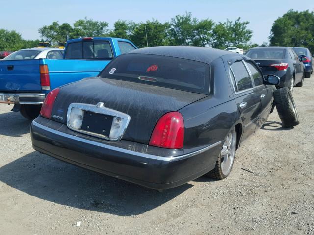 1LNHM83W6XY618839 - 1999 LINCOLN TOWN CAR C BLACK photo 4