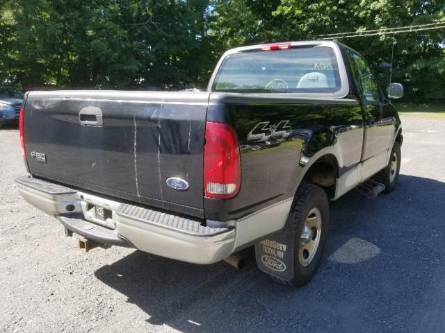 2FTRF18204CA24458 - 2004 FORD F-150 HERI BLACK photo 4