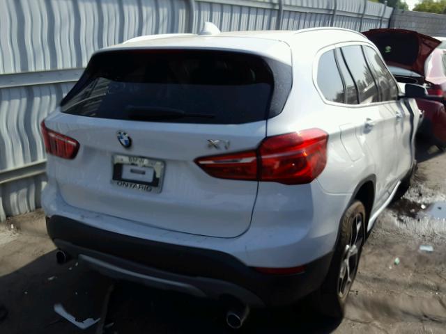 WBXHT3C31G5F66883 - 2016 BMW X1 XDRIVE2 WHITE photo 4