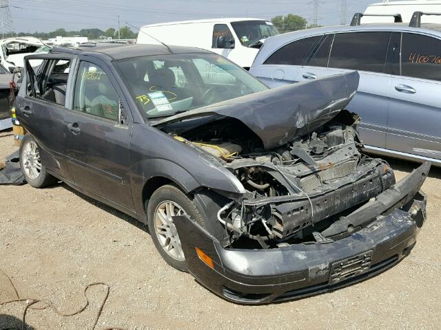 1FAHP34N57W200987 - 2007 FORD FOCUS GRAY photo 1