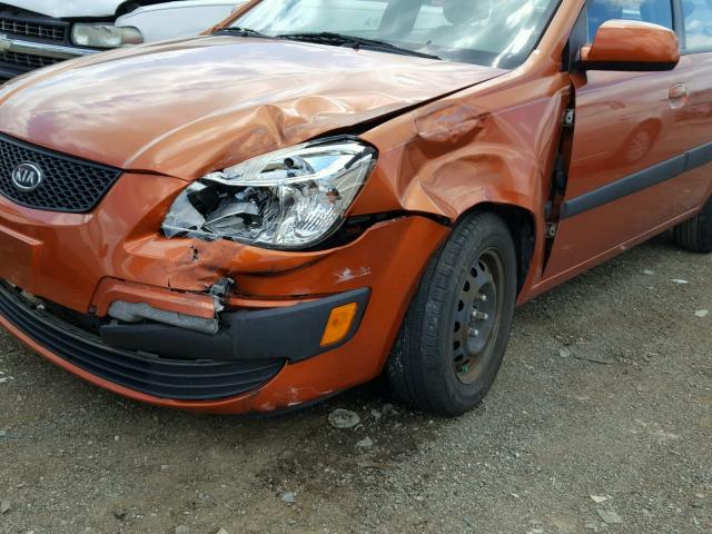 KNADE223696533399 - 2009 KIA RIO BASE ORANGE photo 9